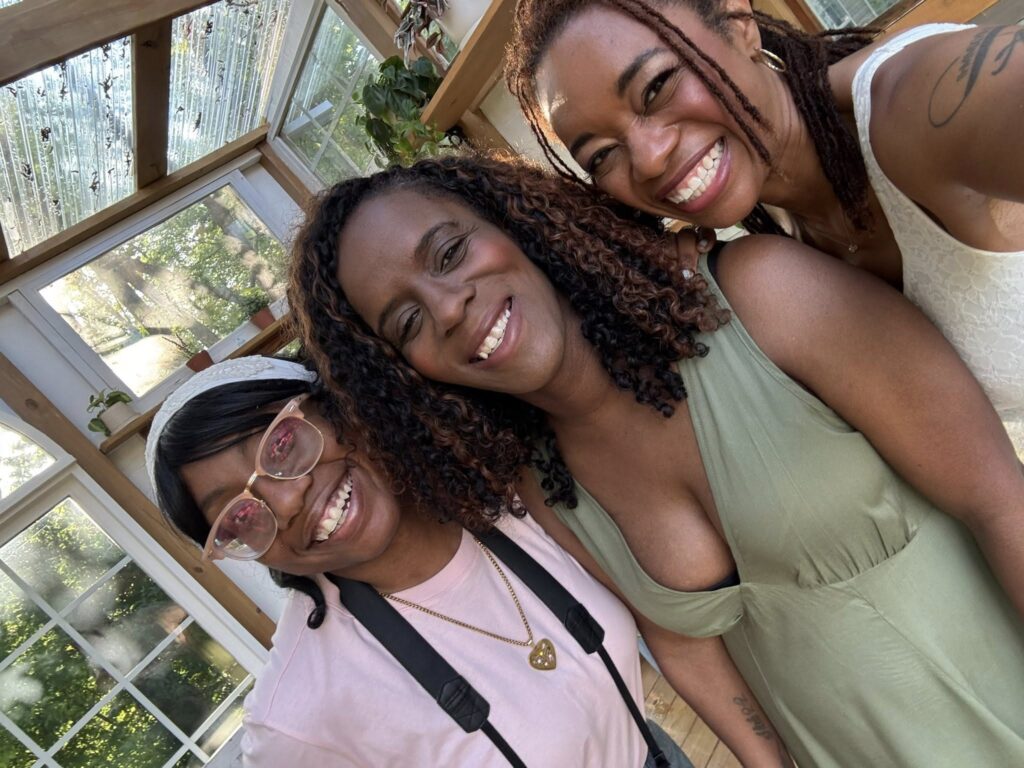 women smiling for a selfie at retreat