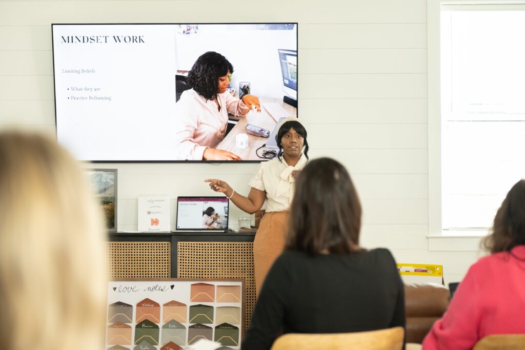 photography business coach teaching women at a retreat